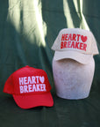 Heart Breaker Trucker hat: Tan / Red