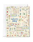 Greeting card with floral patterns and 'welcome baby' text on a white background